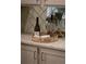 Elegant bar area with mirrored tile backsplash and quartz countertop at 5250 Briarstone Ridge Way, Alpharetta, GA 30022