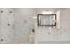 Bathroom with glass enclosed shower and double vanity featuring marble countertops and cabinets at 5250 Briarstone Ridge Way, Alpharetta, GA 30022