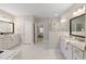 Spacious bathroom featuring a glass-enclosed shower and dual sink vanity with marble countertops at 5250 Briarstone Ridge Way, Alpharetta, GA 30022