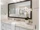 Close-up of bathroom vanity featuring granite countertop, brushed nickel faucet, and white cabinets at 5250 Briarstone Ridge Way, Alpharetta, GA 30022