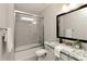 Bathroom with a shower-tub combo with sliding glass doors, vanity, and granite countertops at 5250 Briarstone Ridge Way, Alpharetta, GA 30022