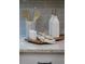 Stylish kitchen detail with wooden utensils, oil bottles, and marble accents at 5250 Briarstone Ridge Way, Alpharetta, GA 30022