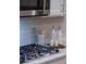 Modern kitchen with stainless steel appliances and subway tile backsplash at 5250 Briarstone Ridge Way, Alpharetta, GA 30022