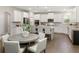 Modern kitchen with white cabinets, stainless appliances, and center island at 5250 Briarstone Ridge Way, Alpharetta, GA 30022
