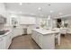 Spacious kitchen with an island, stainless steel appliances, granite countertops and an adjoining dining area at 5250 Briarstone Ridge Way, Alpharetta, GA 30022