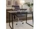 Modern glass desk with a comfortable office chair creating an inviting and functional workspace at 5250 Briarstone Ridge Way, Alpharetta, GA 30022