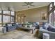 Covered porch with comfortable seating, ceiling fans, and tiled floor, perfect for outdoor living at 5250 Briarstone Ridge Way, Alpharetta, GA 30022
