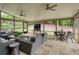 Relaxing screened-in sunroom featuring comfortable seating and outdoor views for comfortable living at 5250 Briarstone Ridge Way, Alpharetta, GA 30022