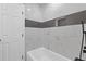 Bright bathroom featuring marble tile and modern black fixtures at 622 Saddlewood Dr, Lawrenceville, GA 30043