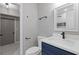 Renovated bathroom with a navy vanity and marble countertop at 622 Saddlewood Dr, Lawrenceville, GA 30043