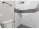 Modern bathroom featuring a sleek black shower head and stylish black and white mosaic tile accent at 622 Saddlewood Dr, Lawrenceville, GA 30043
