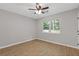 Inviting bedroom with updated flooring, a window, and a ceiling fan at 622 Saddlewood Dr, Lawrenceville, GA 30043