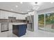 Modern kitchen features white cabinets, stainless steel appliances, and stylish lighting at 622 Saddlewood Dr, Lawrenceville, GA 30043