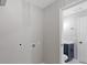 Spacious laundry room with connections and adjacent half-bathroom at 622 Saddlewood Dr, Lawrenceville, GA 30043