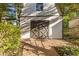 Outbuilding with double doors and stone path, surrounded by lush greenery at 622 Saddlewood Dr, Lawrenceville, GA 30043
