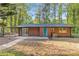 Charming red brick home with a blue door, a covered patio, and a spacious backyard at 622 Saddlewood Dr, Lawrenceville, GA 30043