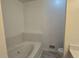 Bathroom with a soaking tub and modern fixtures at 815 Alta Ct, Lithonia, GA 30058