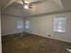 Large bedroom featuring a ceiling fan and three windows at 815 Alta Ct, Lithonia, GA 30058
