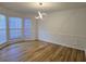 Formal dining room with hardwood floors and modern lighting fixture at 815 Alta Ct, Lithonia, GA 30058