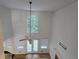 Bright living room with large windows, ceiling fan, and hardwood floors at 815 Alta Ct, Lithonia, GA 30058