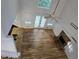 Spacious living room with hardwood floors, fireplace, and natural light at 815 Alta Ct, Lithonia, GA 30058