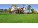 Expansive backyard with a deck and fence, perfect for outdoor entertaining and recreation at 1200 Old Lathemtown Rd, Canton, GA 30115