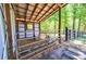 Goats inside the well-lit barn and access to the outdoors in a fenced area at 1200 Old Lathemtown Rd, Canton, GA 30115
