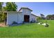 Well-maintained barn with sliding doors, grassy surroundings, and ample space for equestrian activities at 1200 Old Lathemtown Rd, Canton, GA 30115