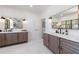 Luxurious bathroom featuring double vanities with modern fixtures, elegant mirrors and lighting at 1200 Old Lathemtown Rd, Canton, GA 30115