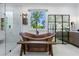 Elegant bathroom featuring a freestanding copper soaking tub with a view of the outdoors at 1200 Old Lathemtown Rd, Canton, GA 30115