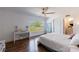 Bright bedroom with hardwood floors, a large window with a field view, and a cozy aesthetic at 1200 Old Lathemtown Rd, Canton, GA 30115