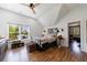 Bedroom featuring natural lighting, hardwood flooring, and views of the backyard at 1200 Old Lathemtown Rd, Canton, GA 30115