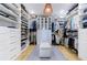 Spacious walk-in closet with custom shelving, drawers, and ample storage space for clothes and accessories at 1200 Old Lathemtown Rd, Canton, GA 30115