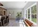 Bright dining area with large windows, bar-style seating and views of backyard at 1200 Old Lathemtown Rd, Canton, GA 30115