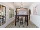 Bright dining area featuring a long table, bar stools, and modern chandelier at 1200 Old Lathemtown Rd, Canton, GA 30115