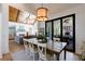 Open dining room with wood table, stylish decor, and view into the living room at 1200 Old Lathemtown Rd, Canton, GA 30115