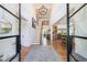 Elegant foyer featuring a high ceiling, staircase, and open view into the kitchen at 1200 Old Lathemtown Rd, Canton, GA 30115