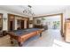 Spacious game room with a billiard table, bar area, wooden beams and rustic decor at 1200 Old Lathemtown Rd, Canton, GA 30115