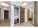 Hallway featuring a barn door pantry, wood-look flooring, and neutral color palette at 1200 Old Lathemtown Rd, Canton, GA 30115
