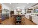 Spacious kitchen with white cabinetry, stainless appliances, large island, and hardwood floors at 1200 Old Lathemtown Rd, Canton, GA 30115