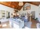 Open-concept living room with cathedral ceilings, wood floors, and comfortable gray sofas at 1200 Old Lathemtown Rd, Canton, GA 30115