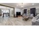 Open-concept living room with a large sofa, dining area, and abundant natural light at 1200 Old Lathemtown Rd, Canton, GA 30115