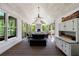 Covered porch with wood ceiling and deck, white painted brick fireplace and comfortable outdoor seating at 1200 Old Lathemtown Rd, Canton, GA 30115
