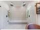 Spacious walk-in shower with dual shower heads, built-in bench, and modern tile design at 1200 Old Lathemtown Rd, Canton, GA 30115