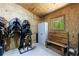 This tack room features saddle racks, storage, a bench, and a window on a sunny day at 1200 Old Lathemtown Rd, Canton, GA 30115