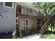Exterior view showcasing a wooden deck with stairs, offering ample outdoor living space and backyard access at 3043 Alston Dr, Decatur, GA 30032
