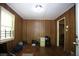 Bedroom with wood paneling, window and hardwood floors at 3043 Alston Dr, Decatur, GA 30032