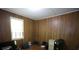 Bedroom with wood paneling, window and hardwood floors at 3043 Alston Dr, Decatur, GA 30032