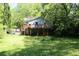 Charming home exterior with a deck nestled in a lush, green landscape at 3043 Alston Dr, Decatur, GA 30032