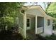 Charming covered front porch with white railings, providing a cozy entrance to this home at 3043 Alston Dr, Decatur, GA 30032